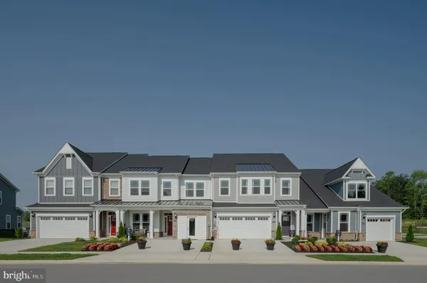 a front view of residential houses with street