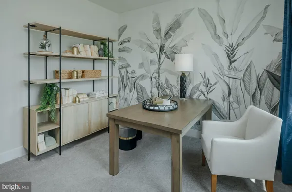 a view of work room with furniture and wooden floor