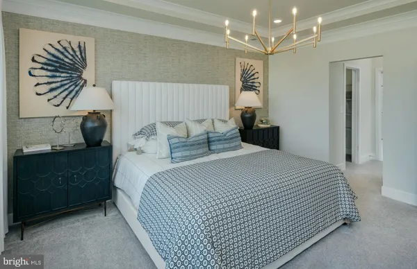 a bedroom with a bed and a night stand