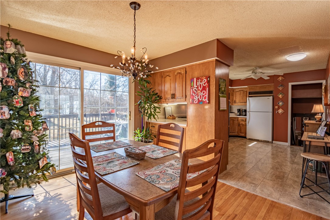 75 Ridgedale Drive Decatur, IL 62521 - Photo 7 of 26 a view of a dining room with furniture window and wooden floor