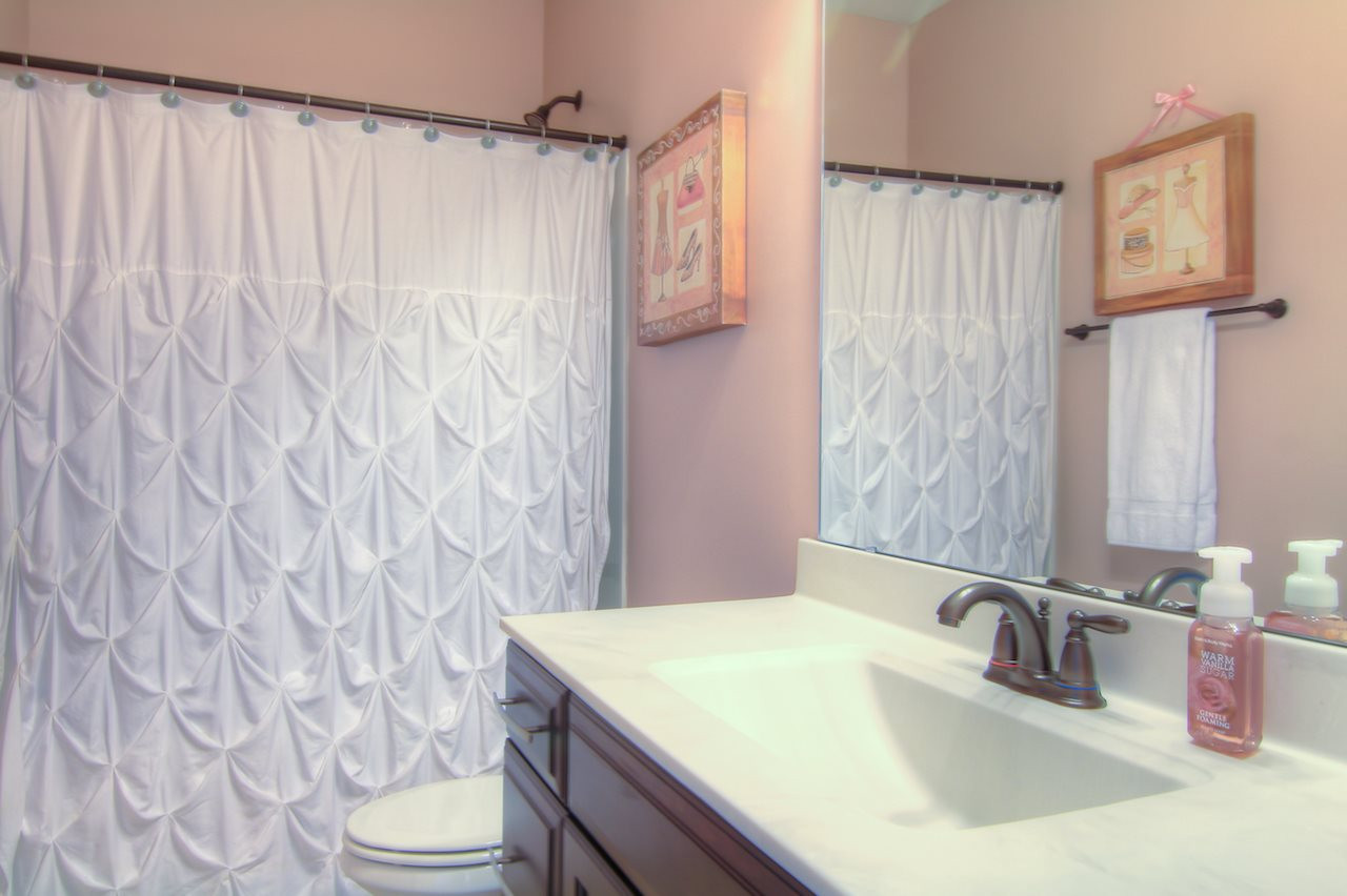 8333 Henderson Road Apex, NC 27539 - Photo 18 of 25 This bathroom is situated between Bedroom #1 & Bedroom #2 on the 2nd floor. Bathroom