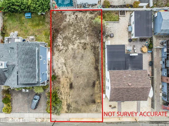 a view of a white house with a yard