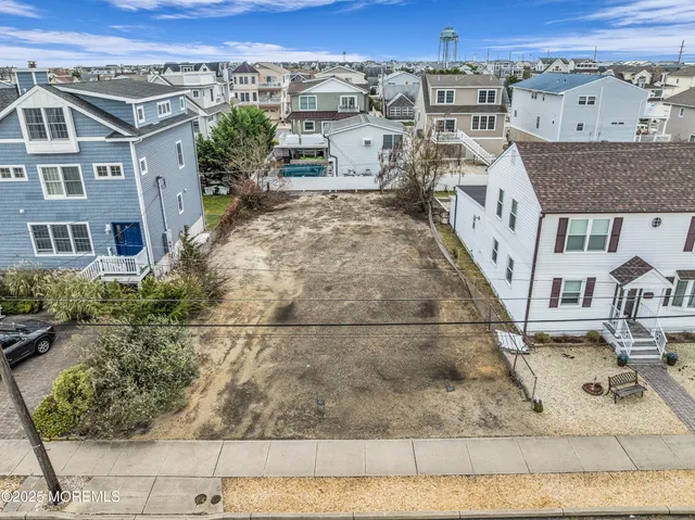 an aerial view of a house with a swimming pool