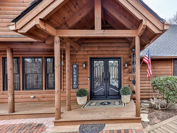 a view of an entryway with a rug and front door