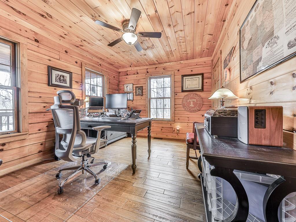 1670 Outback Road Jasper, GA 30143 - Photo 31 of 75 a work room with furniture and wooden floor