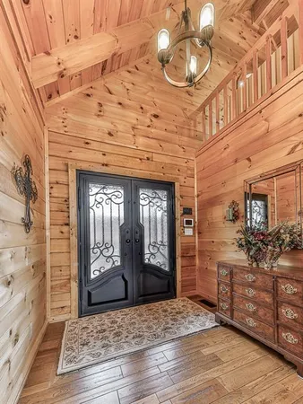 a view of a room with wooden floor and furniture