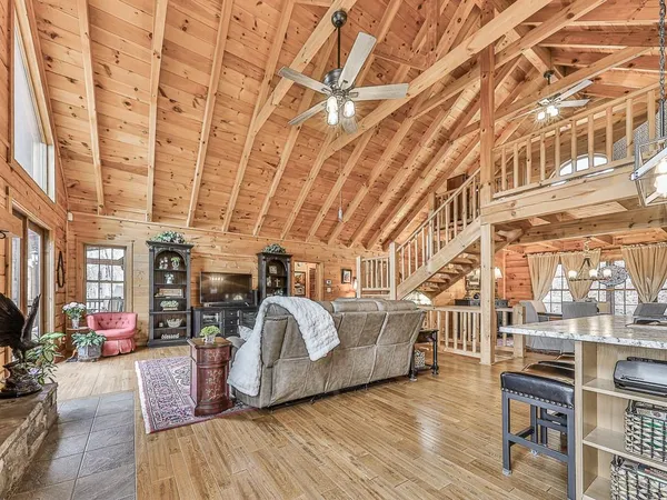 a kitchen with stainless steel appliances granite countertop a sink a stove a refrigerator and cabinets