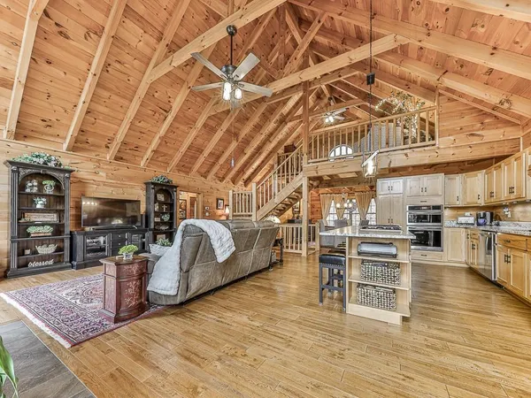 a view of a room with lots of wooden furniture