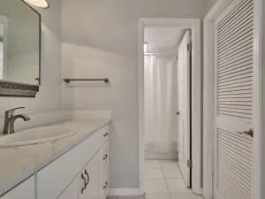 a bathroom with a double vanity sink and a mirror