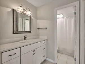a bathroom with a tub and a shower curtain