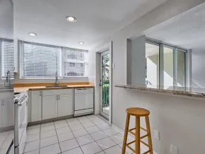a view of kitchen with furniture and large window