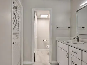 a bathroom with a glass shower door
