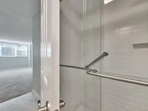 a view of a hallway with wooden floor