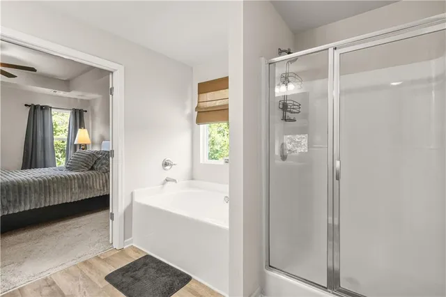 a bathroom with a bathtub and a window