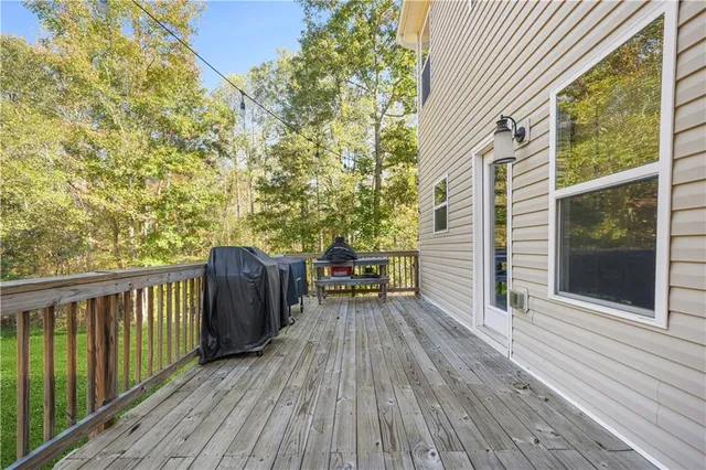 a view of a park with a trees in the background