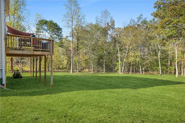 a backyard of a house with lots of green space