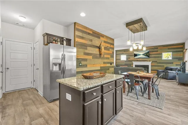 a kitchen with a table and chairs
