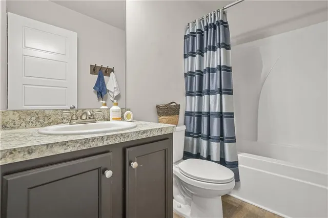 a bedroom with a bed chair and window