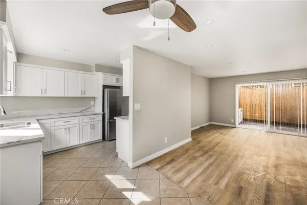 a kitchen with a sink cabinets and window