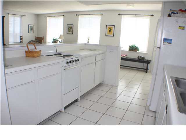 556 Blue Mountain Beach Road Santa Rosa Beach, FL 32459 - Photo 5 of 14 a bathroom with a sink a mirror and a bathtub