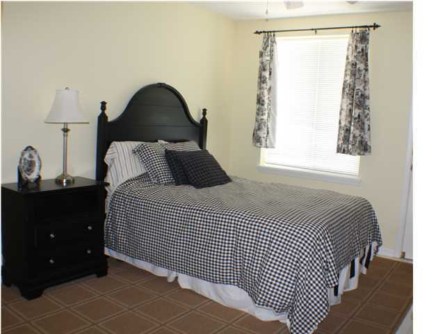 556 Blue Mountain Beach Road Santa Rosa Beach, FL 32459 - Photo 7 of 14 a bedroom with a bed and a window