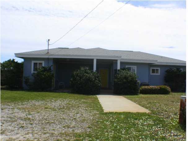 556 Blue Mountain Beach Road Santa Rosa Beach, FL 32459 - Photo 8 of 14 a front view of house with yard and green space