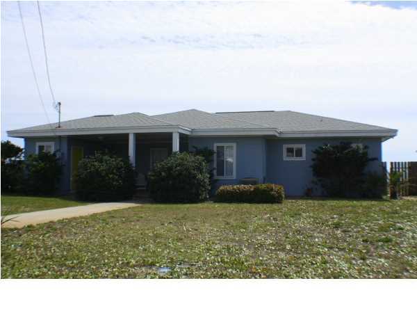 556 Blue Mountain Beach Road Santa Rosa Beach, FL 32459 - Photo 9 of 14 a view of a house with garden and yard