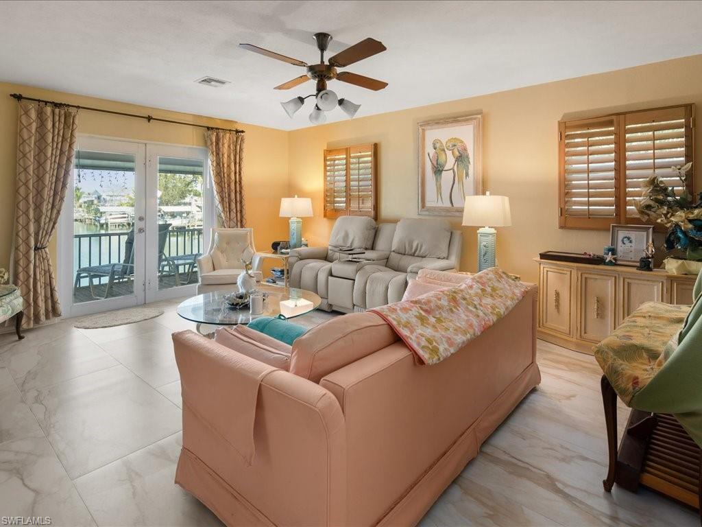 565 Coconut Avenue Goodland, FL 34140 - Photo 11 of 35 Living room featuring french doors and ceiling fan