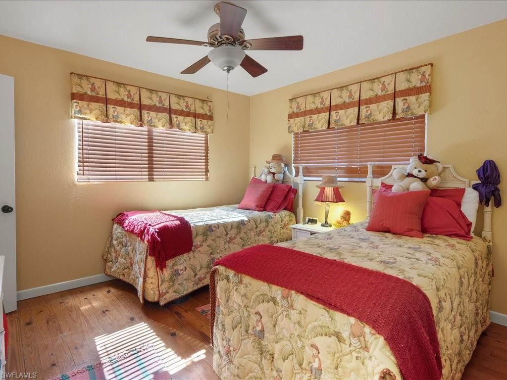 565 Coconut Avenue Goodland, FL 34140 - Photo 16 of 35 Bedroom with wood-type flooring and ceiling fan