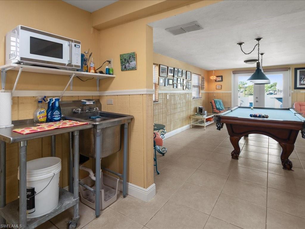 565 Coconut Avenue Goodland, FL 34140 - Photo 21 of 35 Game room with billiards and light tile patterned flooring