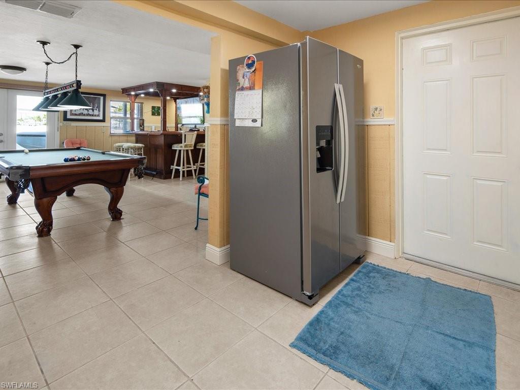 565 Coconut Avenue Goodland, FL 34140 - Photo 22 of 35 Rec room featuring light tile patterned floors, billiards, and indoor bar