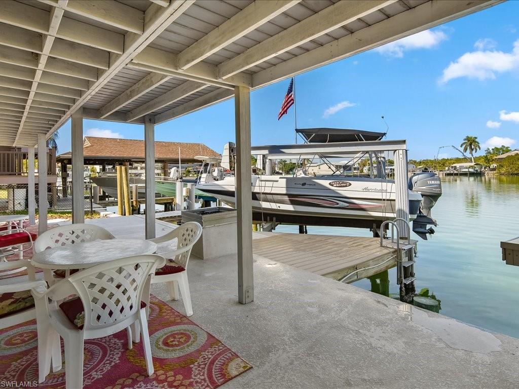 565 Coconut Avenue Goodland, FL 34140 - Photo 27 of 35 View of dock with a water view