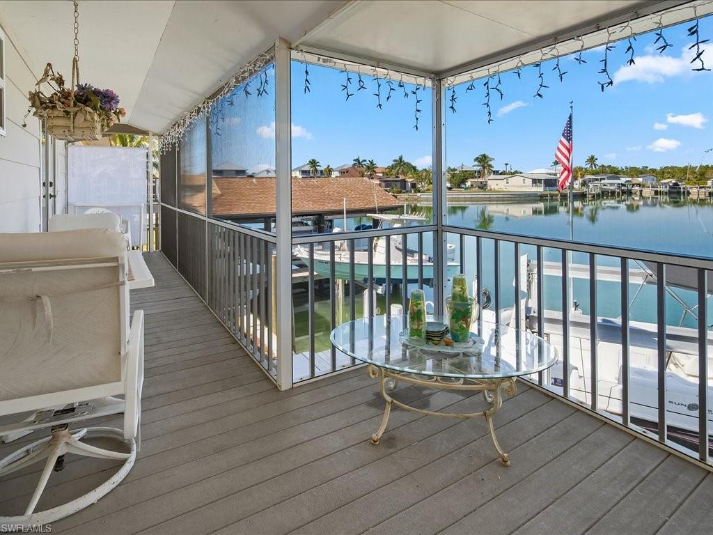 565 Coconut Avenue Goodland, FL 34140 - Photo 5 of 35 Wooden terrace featuring a water view