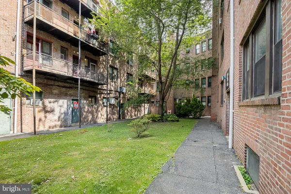 a view of a street with brick building in the background
