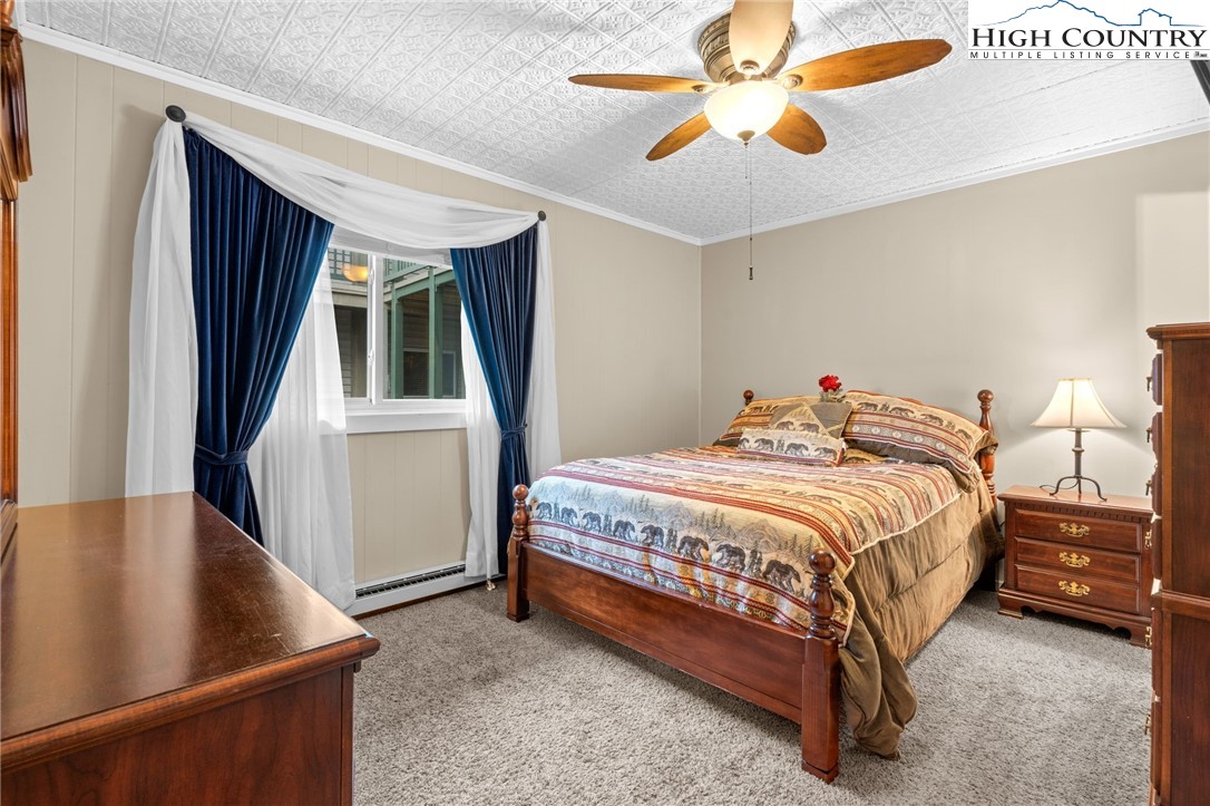 301 Pinnacle Inn Road, Unit 3219 Beech Mountain, NC 28604 - Photo 12 of 30 a bed sitting in a bedroom next to a window