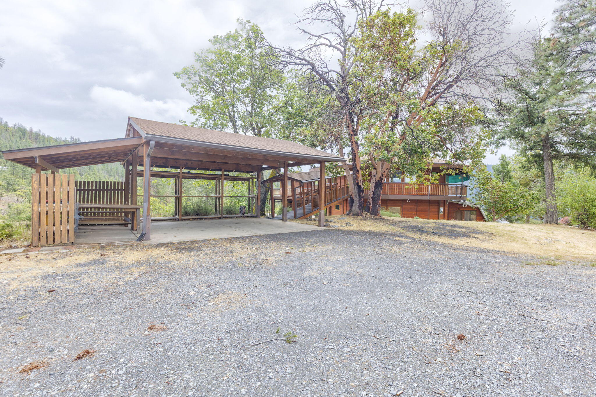 9595 Sterling Creek Road Jacksonville, OR 97530 - Photo 46 of 76 a view of a house with a yard and large tree