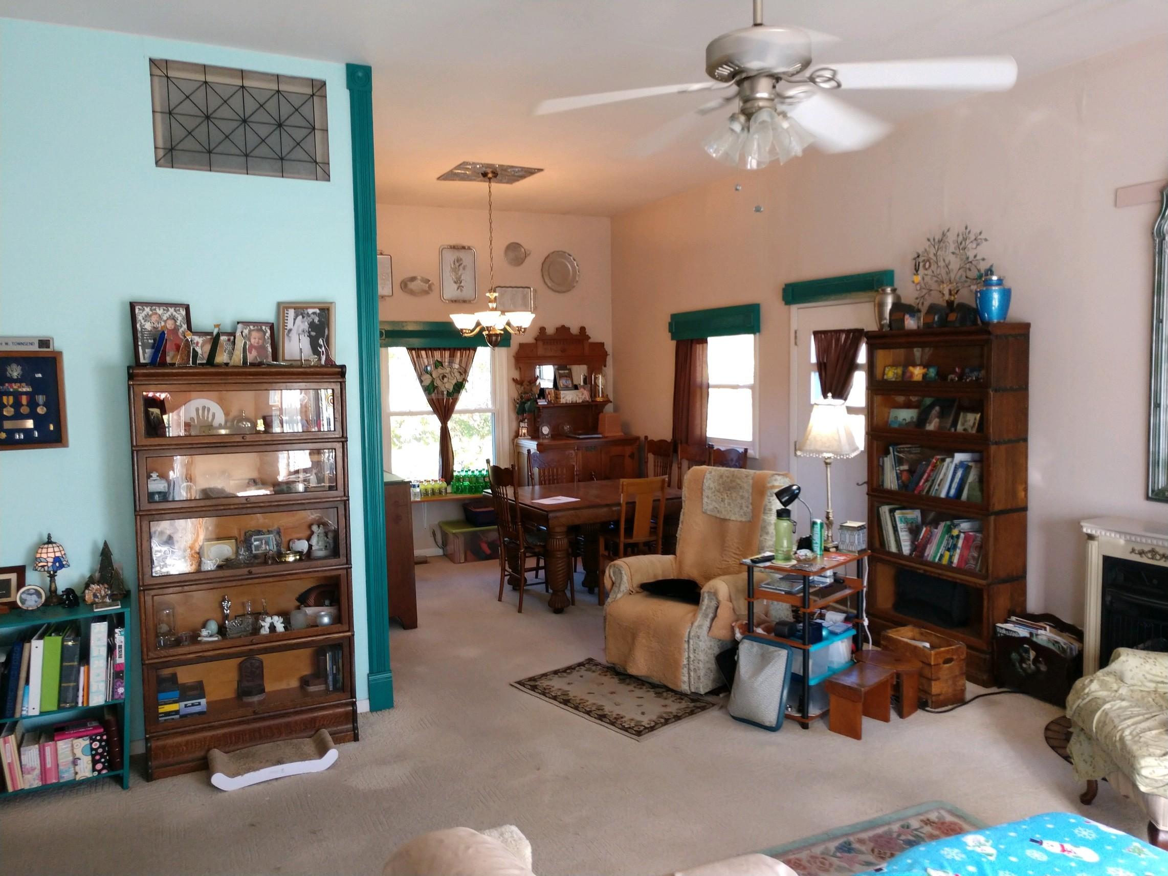 152 Oak View Lane Northeast Riner, VA 24149 - Photo 12 of 39 a living room with lots of furniture and a chandelier