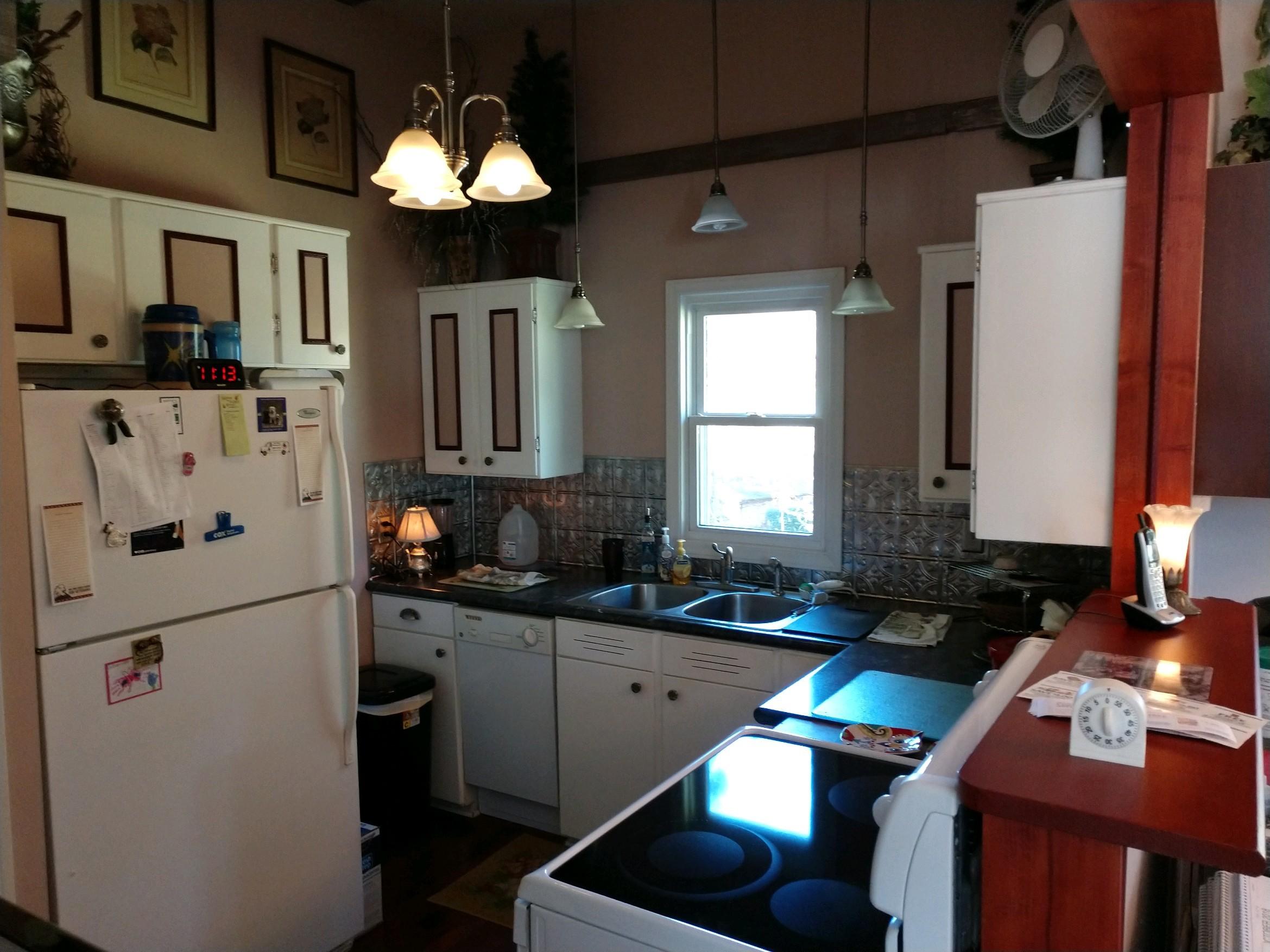 152 Oak View Lane Northeast Riner, VA 24149 - Photo 16 of 39 a kitchen with stainless steel appliances granite countertop a sink a stove and a refrigerator