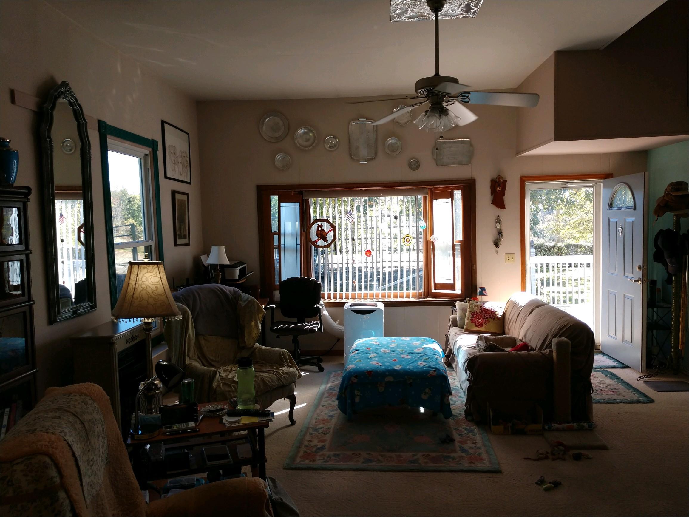 152 Oak View Lane Northeast Riner, VA 24149 - Photo 19 of 39 a living room with furniture and a large window