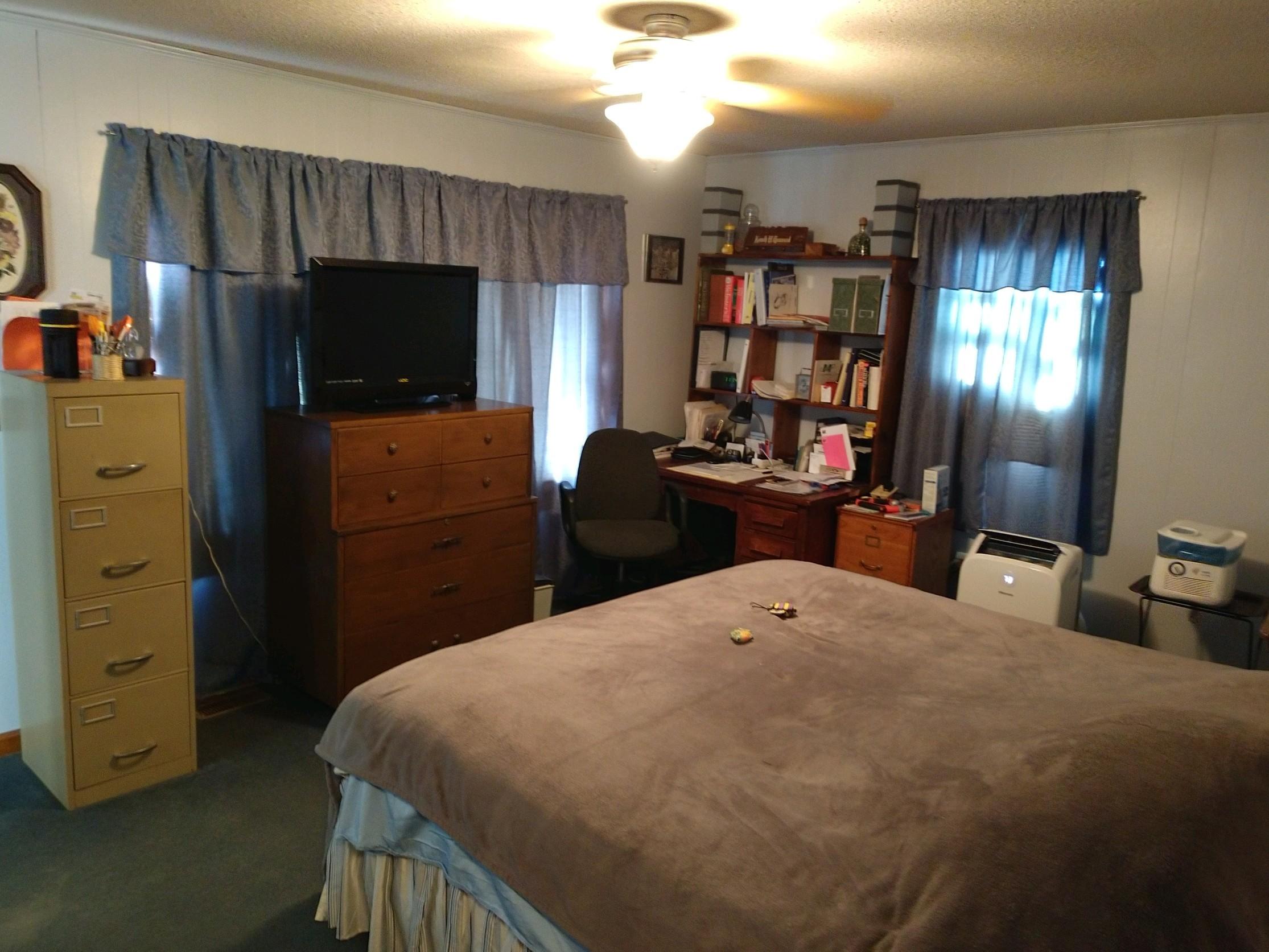 152 Oak View Lane Northeast Riner, VA 24149 - Photo 21 of 39 a bed room with a bed and a television