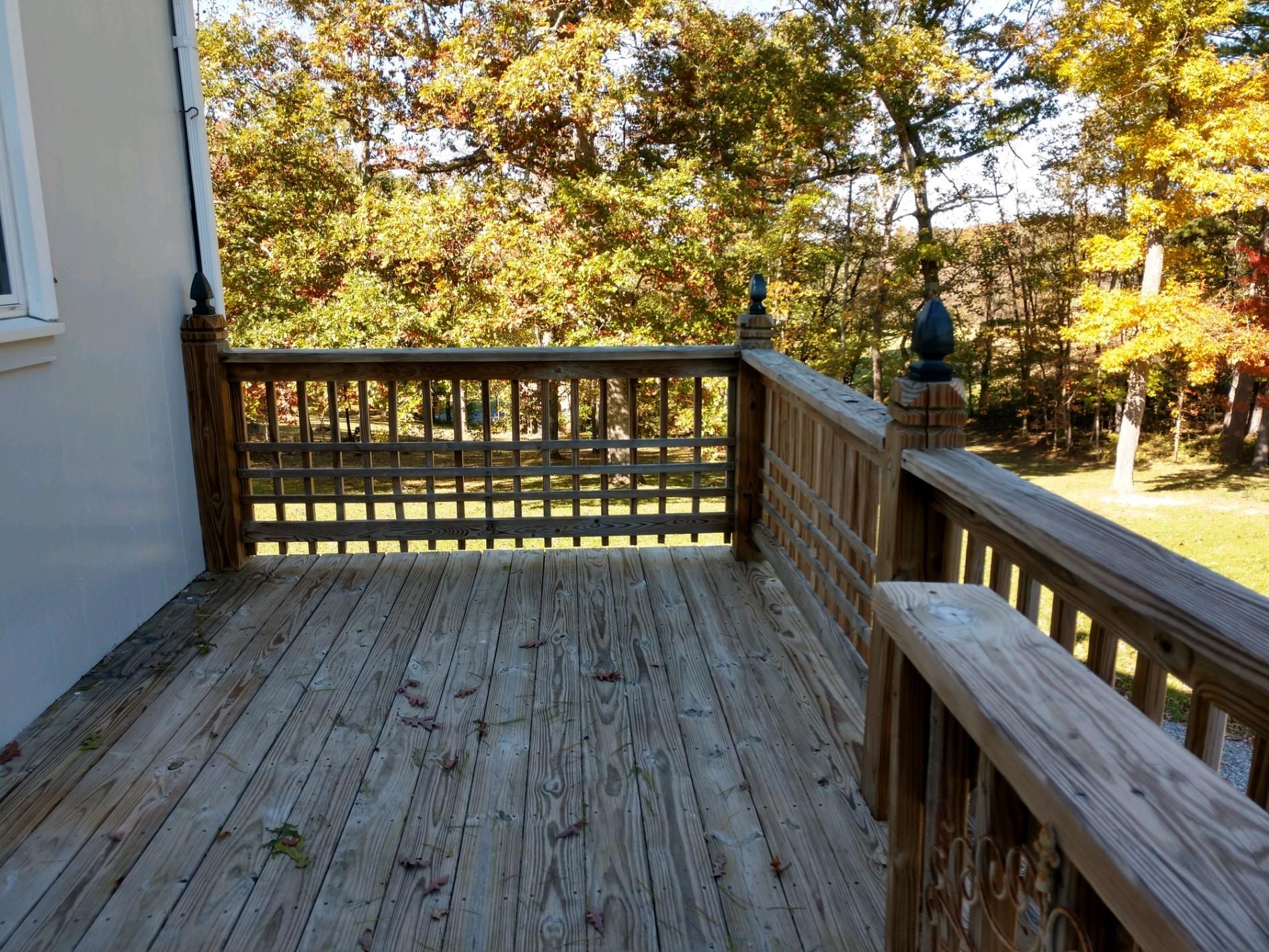 152 Oak View Lane Northeast Riner, VA 24149 - Photo 35 of 39 a balcony with wooden floor and fence