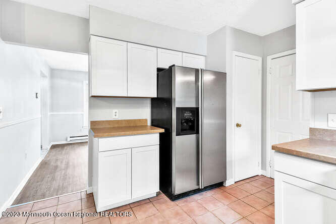 407 Cook Road Jackson, NJ 08527 - Photo 12 of 25 a kitchen with stainless steel appliances a refrigerator and a stove