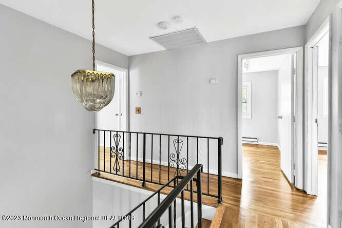 407 Cook Road Jackson, NJ 08527 - Photo 15 of 25 a view of a hallway with wooden floor