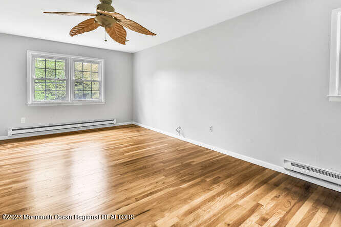 407 Cook Road Jackson, NJ 08527 - Photo 16 of 25 wooden floor in an empty room with a window