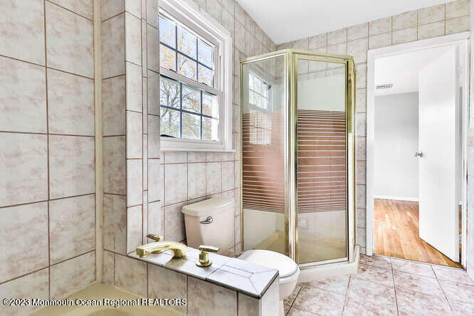 407 Cook Road Jackson, NJ 08527 - Photo 19 of 25 a bathroom with a sink and a mirror