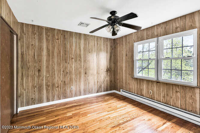 407 Cook Road Jackson, NJ 08527 - Photo 20 of 25 a view of a livingroom with a ceiling fan and wooden floor