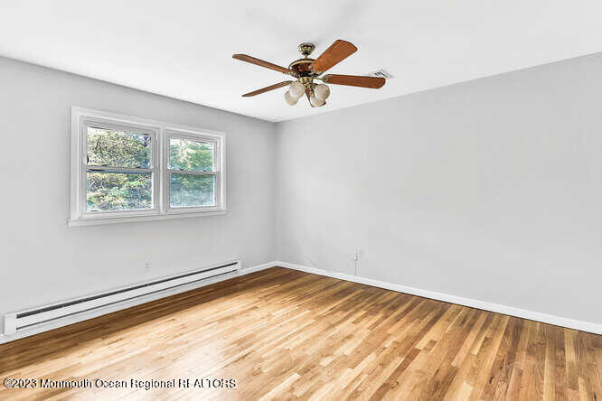 407 Cook Road Jackson, NJ 08527 - Photo 21 of 25 a view of an empty room with a window