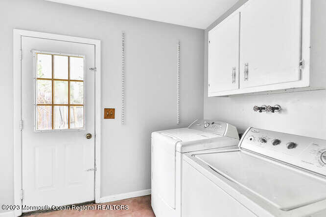 407 Cook Road Jackson, NJ 08527 - Photo 23 of 25 a view of washer and dryer with white cabinet