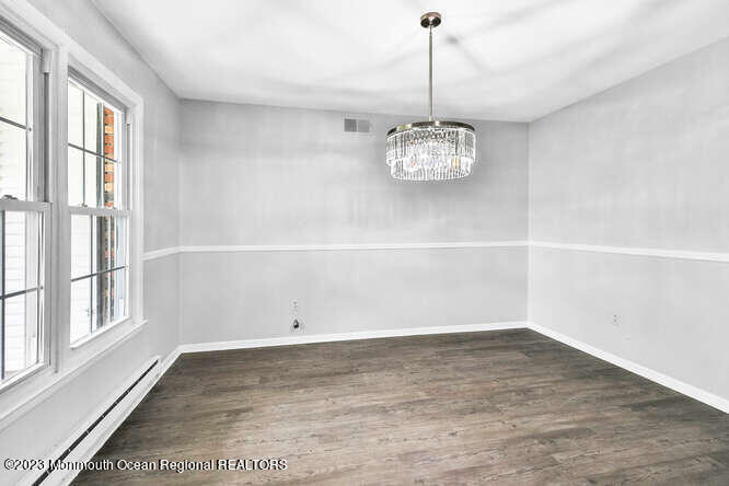 407 Cook Road Jackson, NJ 08527 - Photo 6 of 25 a view of an empty room with a window