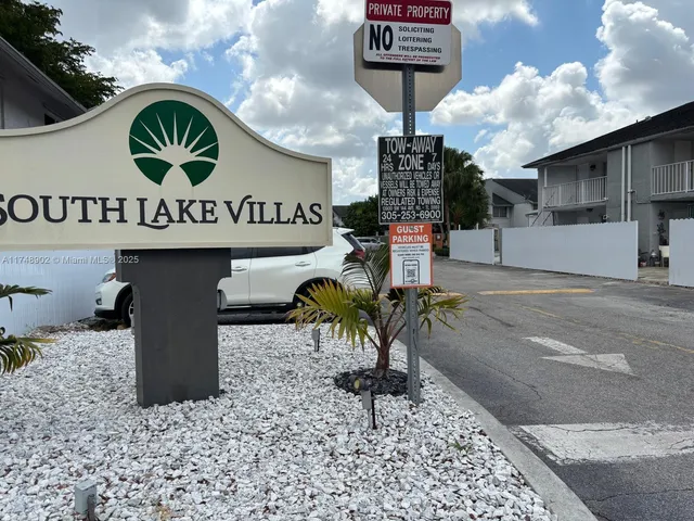 a view of a car park in front of house